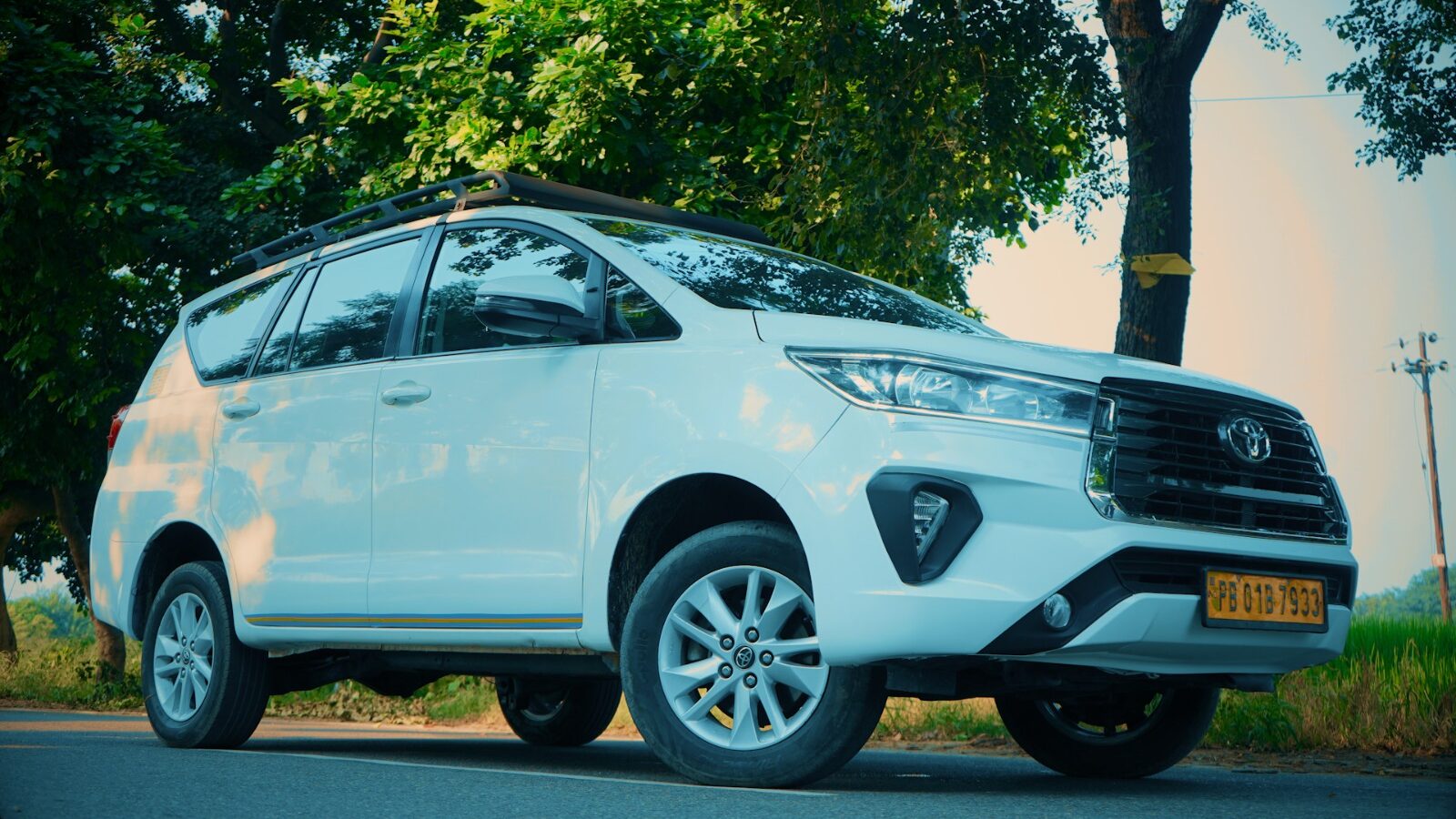 Luxury taxi service: White Toyota Innova Crysta front view