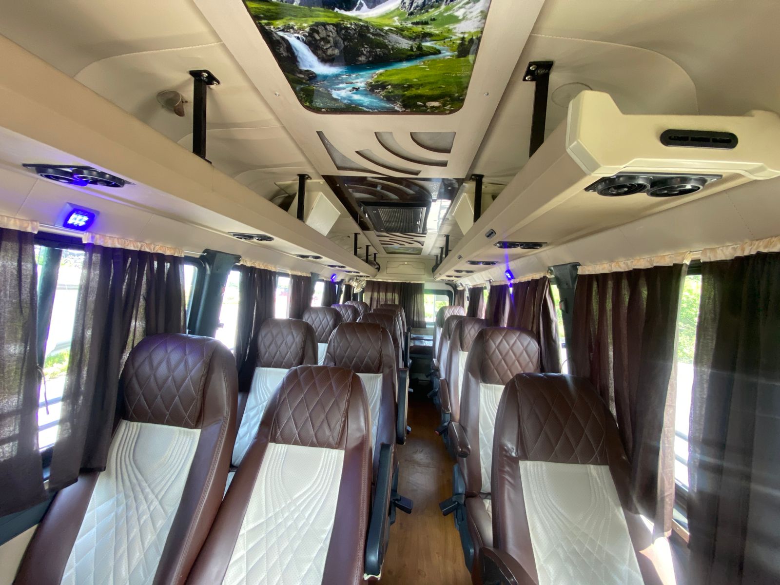 van interior with scenic roof and two-tone quilted seating