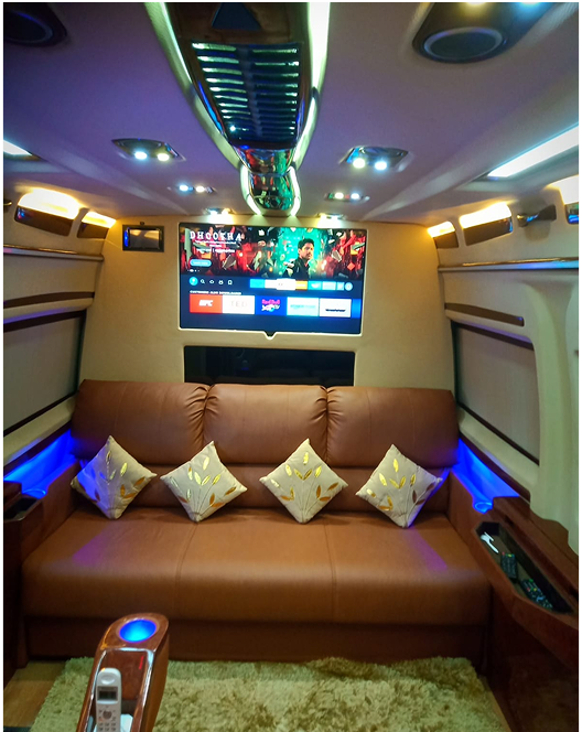 Luxury van interior with brown sofa and TV